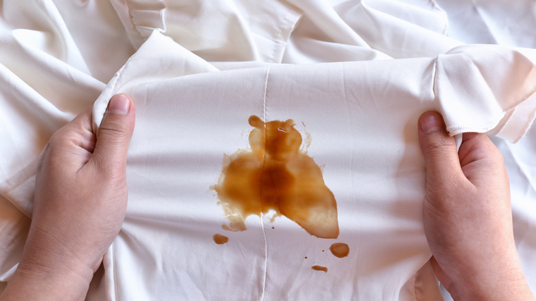 large coffee stain on white shirt 
