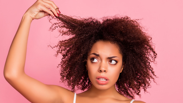 Woman pulling her hair