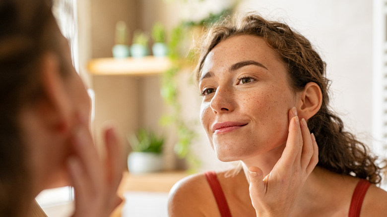 Examining the face in a mirror
