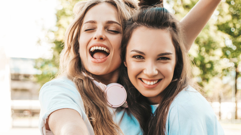 Two girls laughing