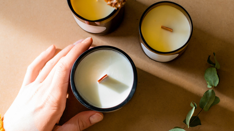 Woman touching candles