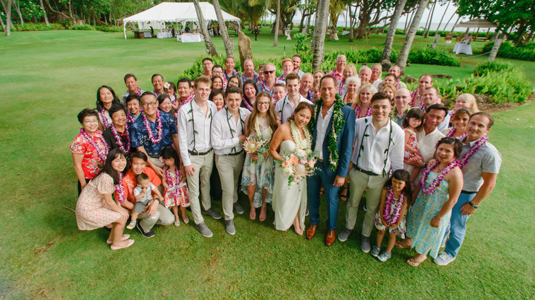 Wedding couple with guests