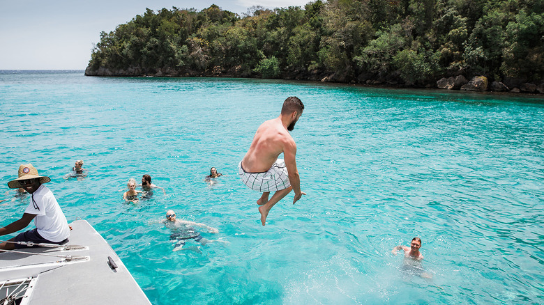Man diving off boat