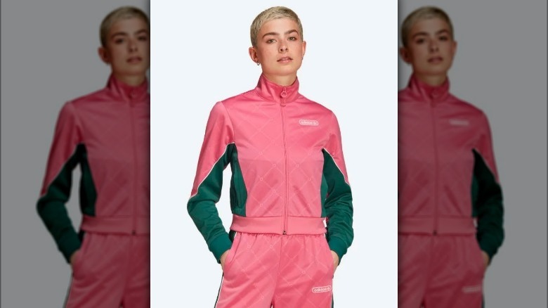 Model wearing pink and green tracksuit