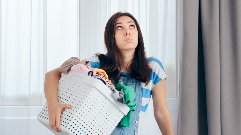 woman holding laundry basket