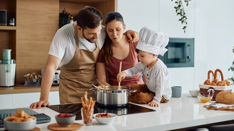 Family prepares pasta 