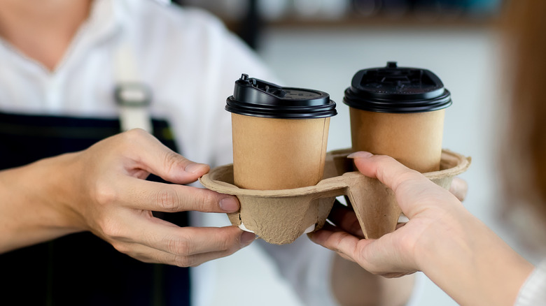 Coffee being handed to someone