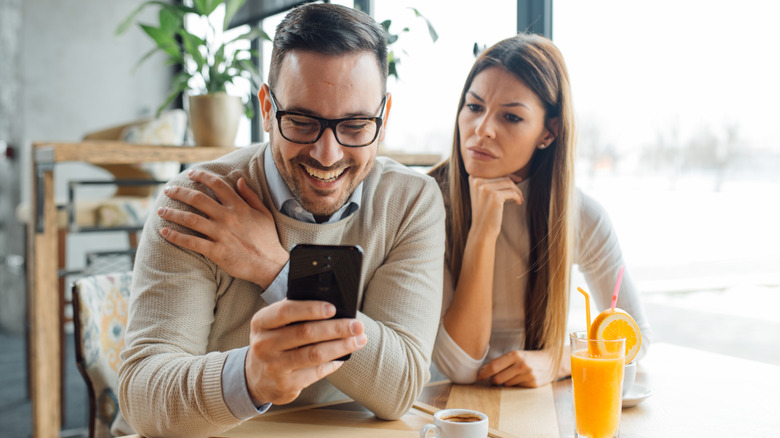 Woman over his shoulder