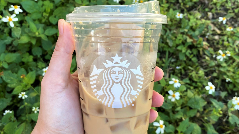 Iced Starbucks latte with metal straw