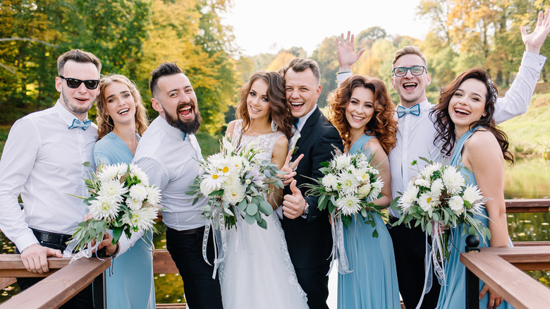 wedding party smiling at the camera