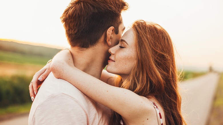 Couple hugging outside