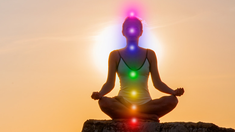 Woman with lit seven chakras