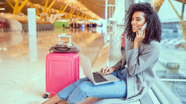 Woman with luggage at airport