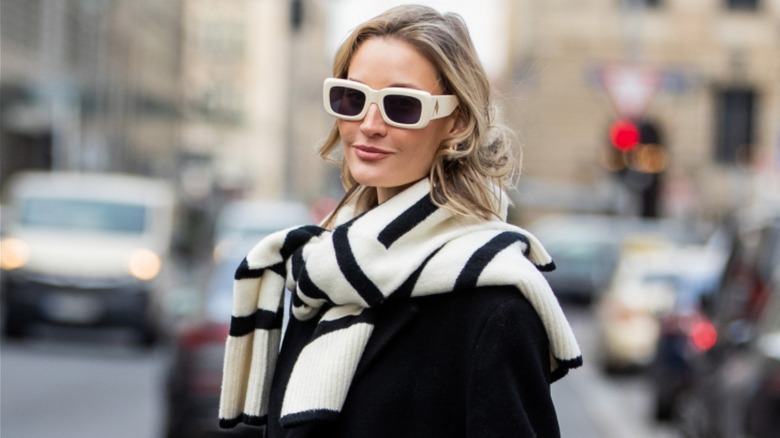 Woman wearing sunglasses and sweater 