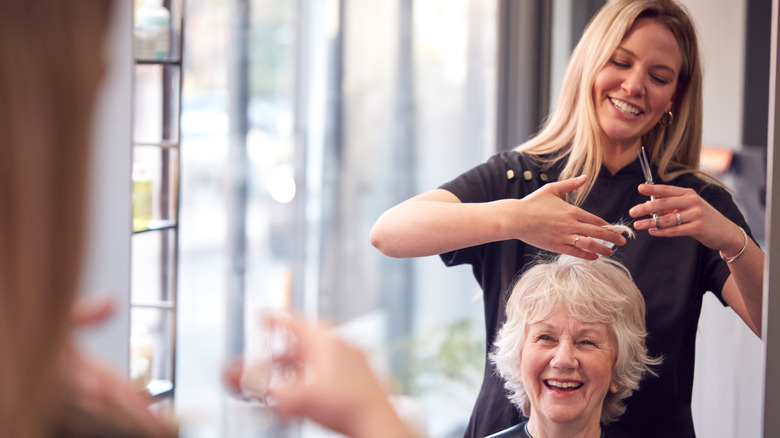 Hairstylist working on client