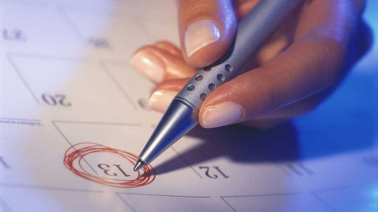 woman circling on calendar 