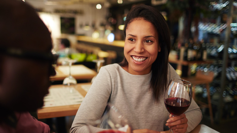 Woman drinking red wine