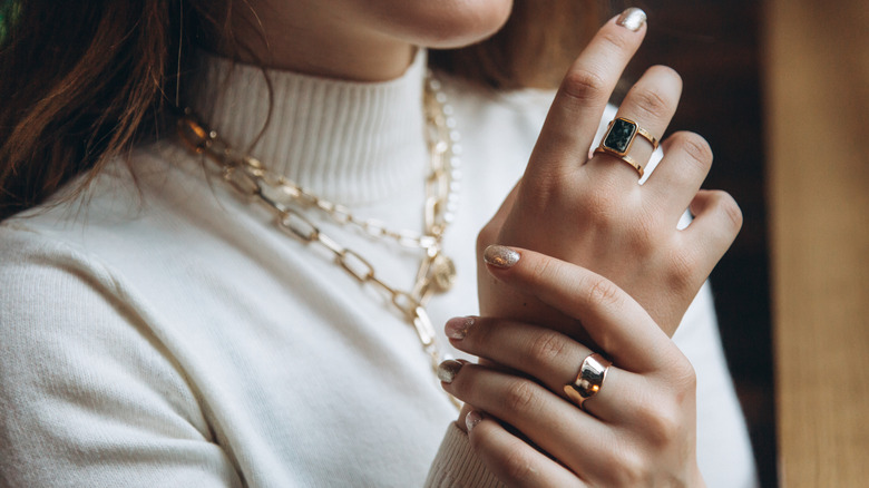 woman wearing gold jewelry