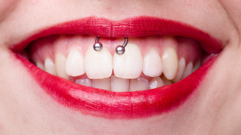 woman with smiley piercing smiling