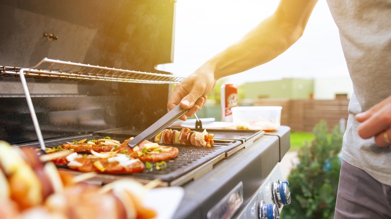 person grilling