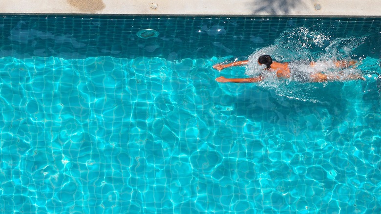 boy swimming in a pool