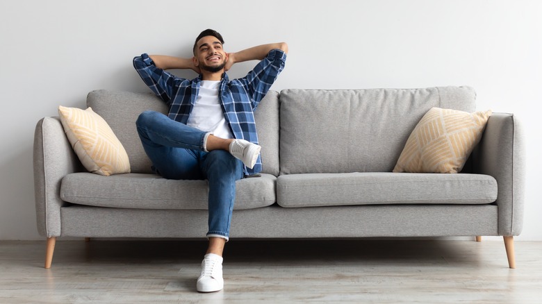 man sitting on couch