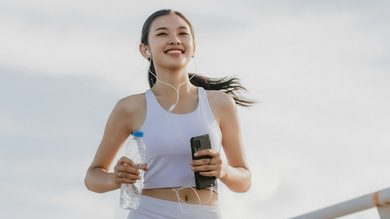 woman running with hair back