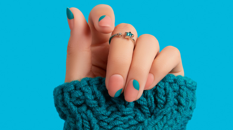 Woman wearing ring with sweater