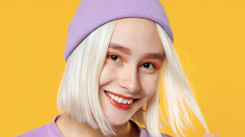 Woman wearing hat with bob haircut