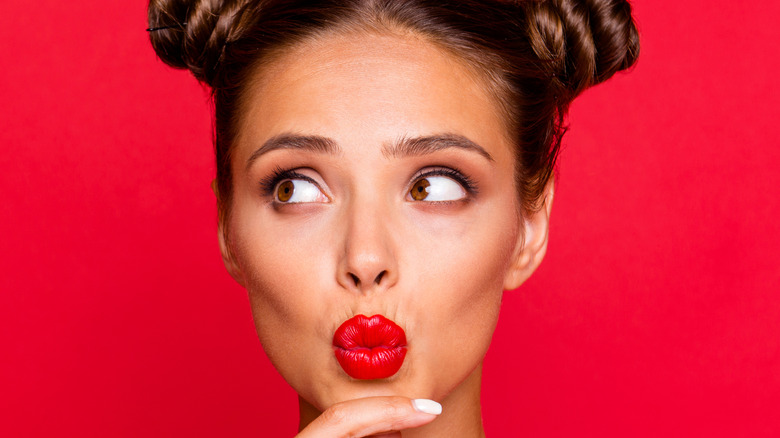 Young woman wearing red lipstick 