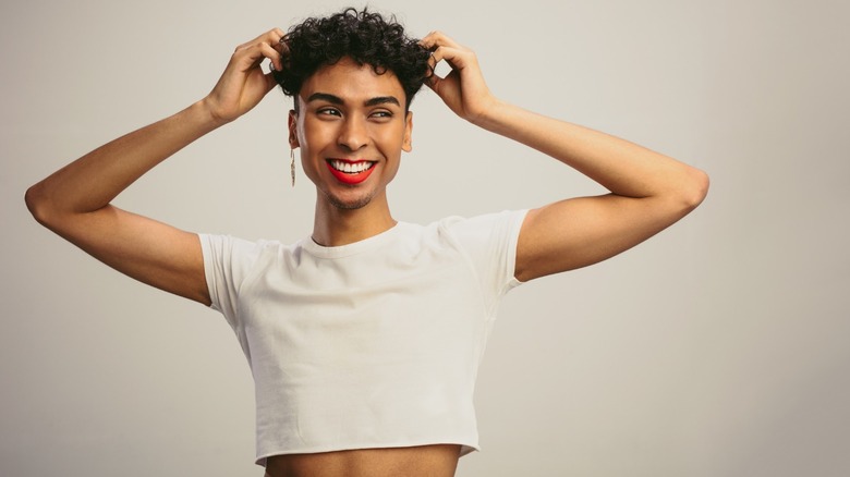 androgynous person crop top