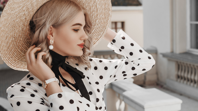 woman posing in polka dot outfit