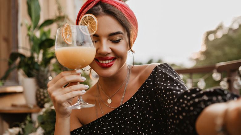 woman smiling wearing polka dots