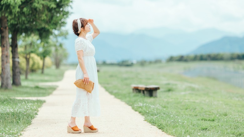 woman in dress in the sun