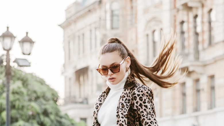 fashionable woman with high ponytail