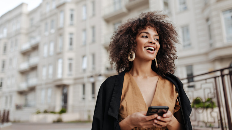 Woman with curly thick hair taking a stroll