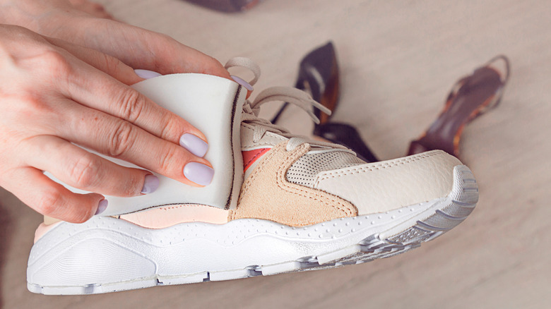 Woman wiping down shoe