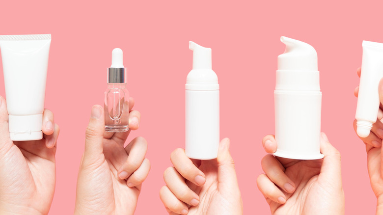 hands holding skincare products