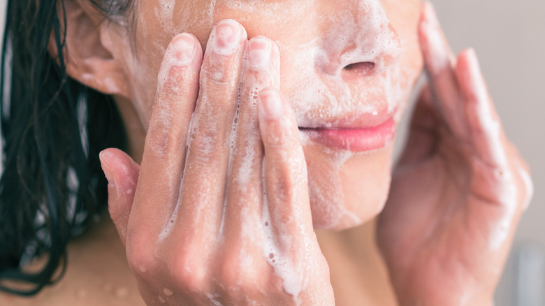 woman washing face