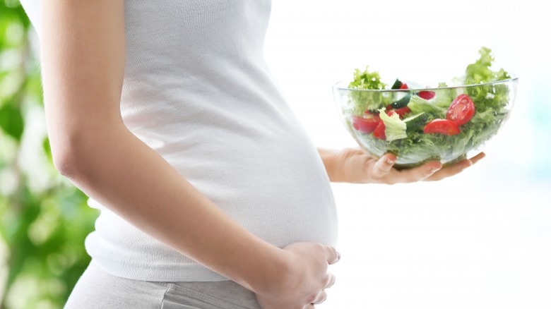 pregnant woman with salad