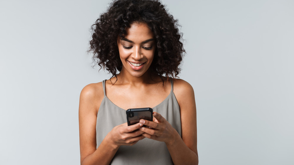 beautiful woman looking at phone