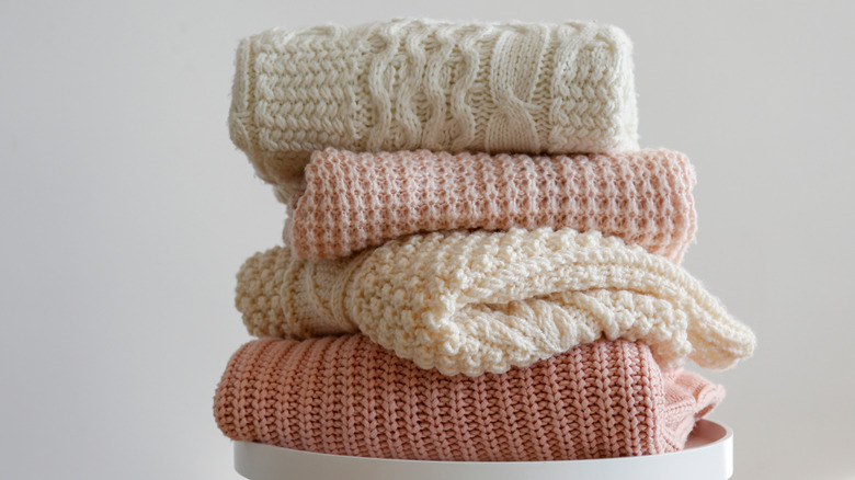 Stack of folded sweaters 
