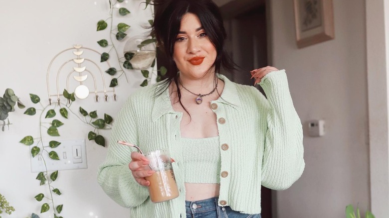 Woman in jeans and green top