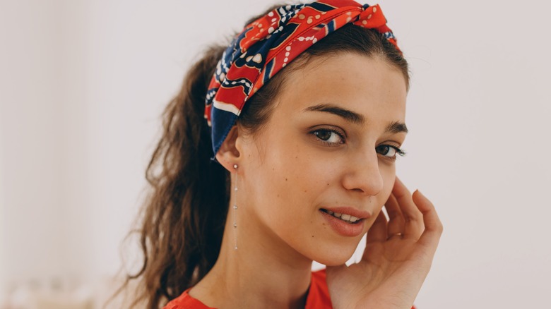 Woman wearing red and blue bandana