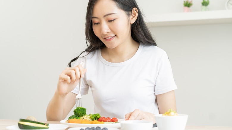 A woman eating a salad