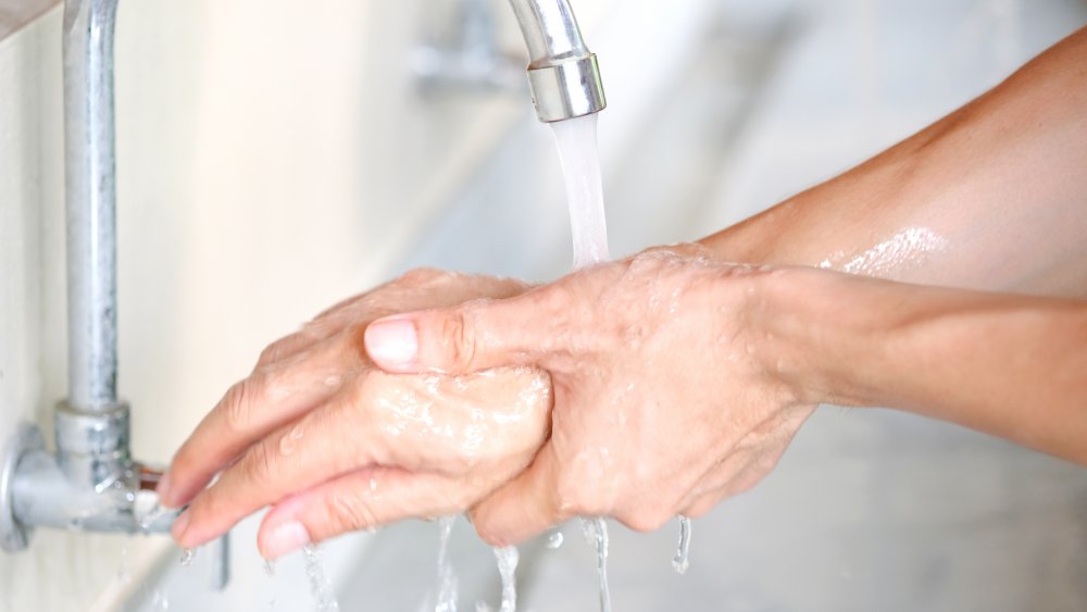 Woman washing her hands