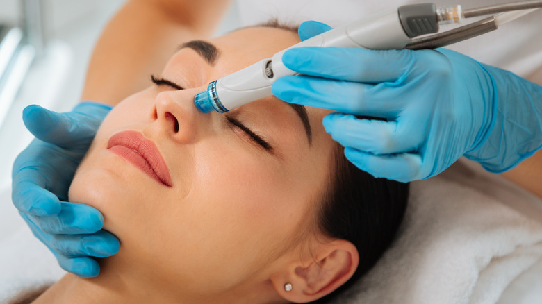 Person getting a hydrafacial treatment