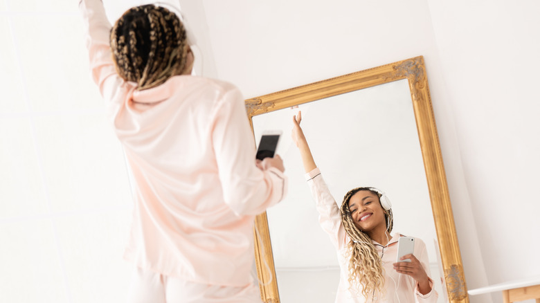 Woman taking a mirror selfie