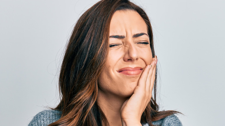 Woman with pained face