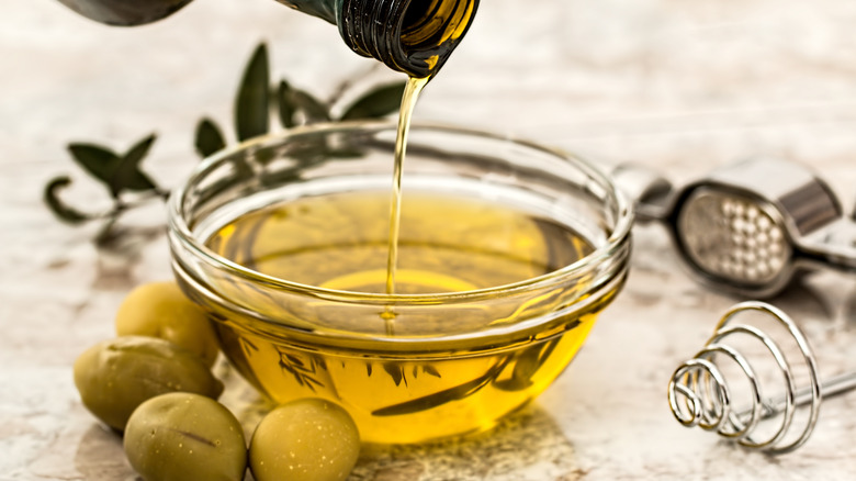 Olive oil poured into a bowl